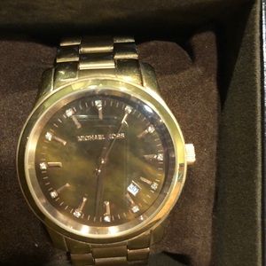 Michael Kors Rose gold watch.